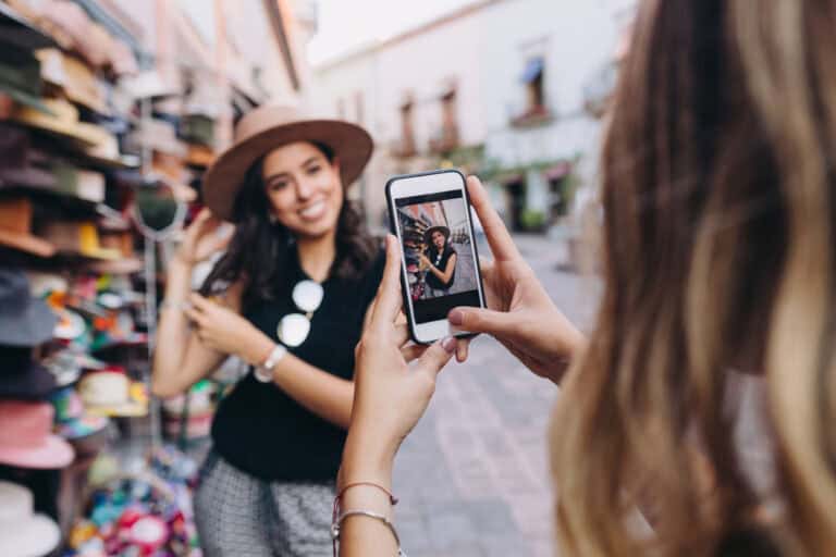 Woman wearaing a hat having her picture taken