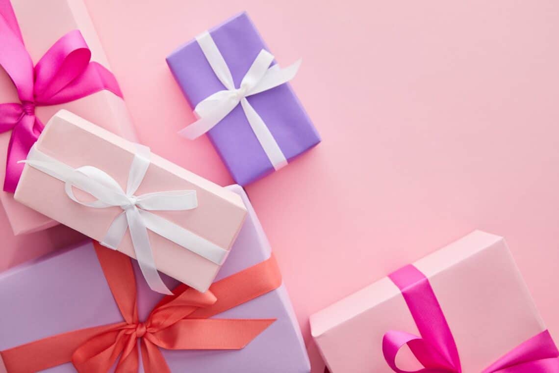 Pink and purple presents on a pink background